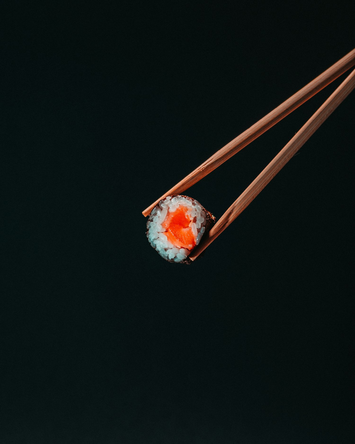 A single bite held in chopsticks