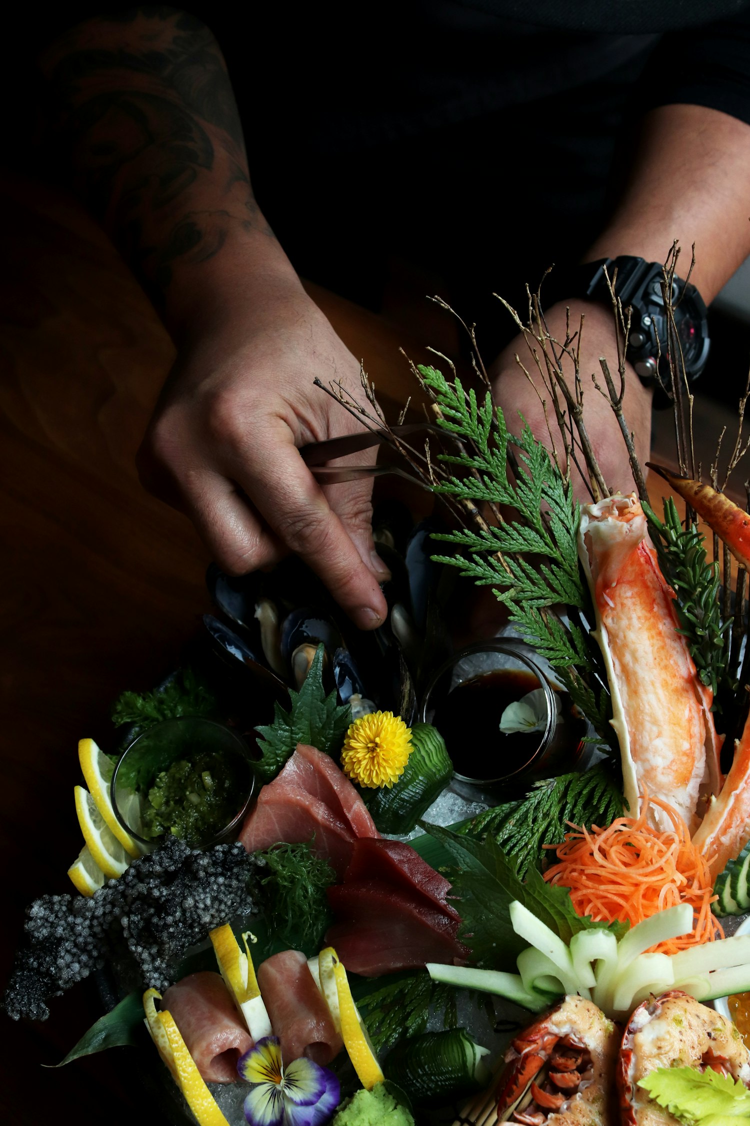 Chef's hands finishing a course