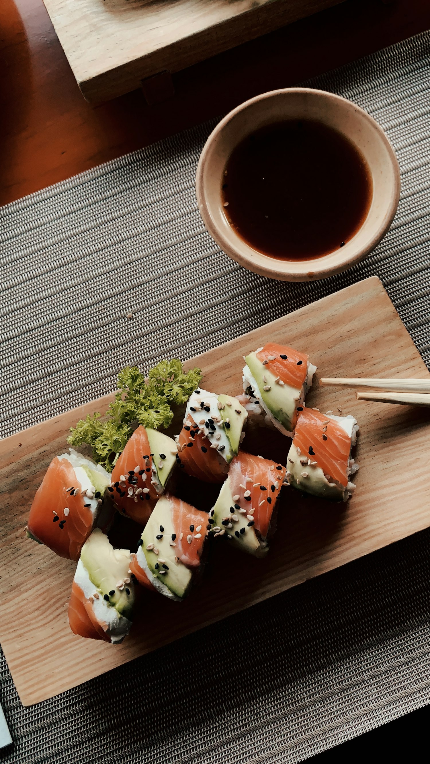 A warm cup of tea and chopsticks resting at the counter