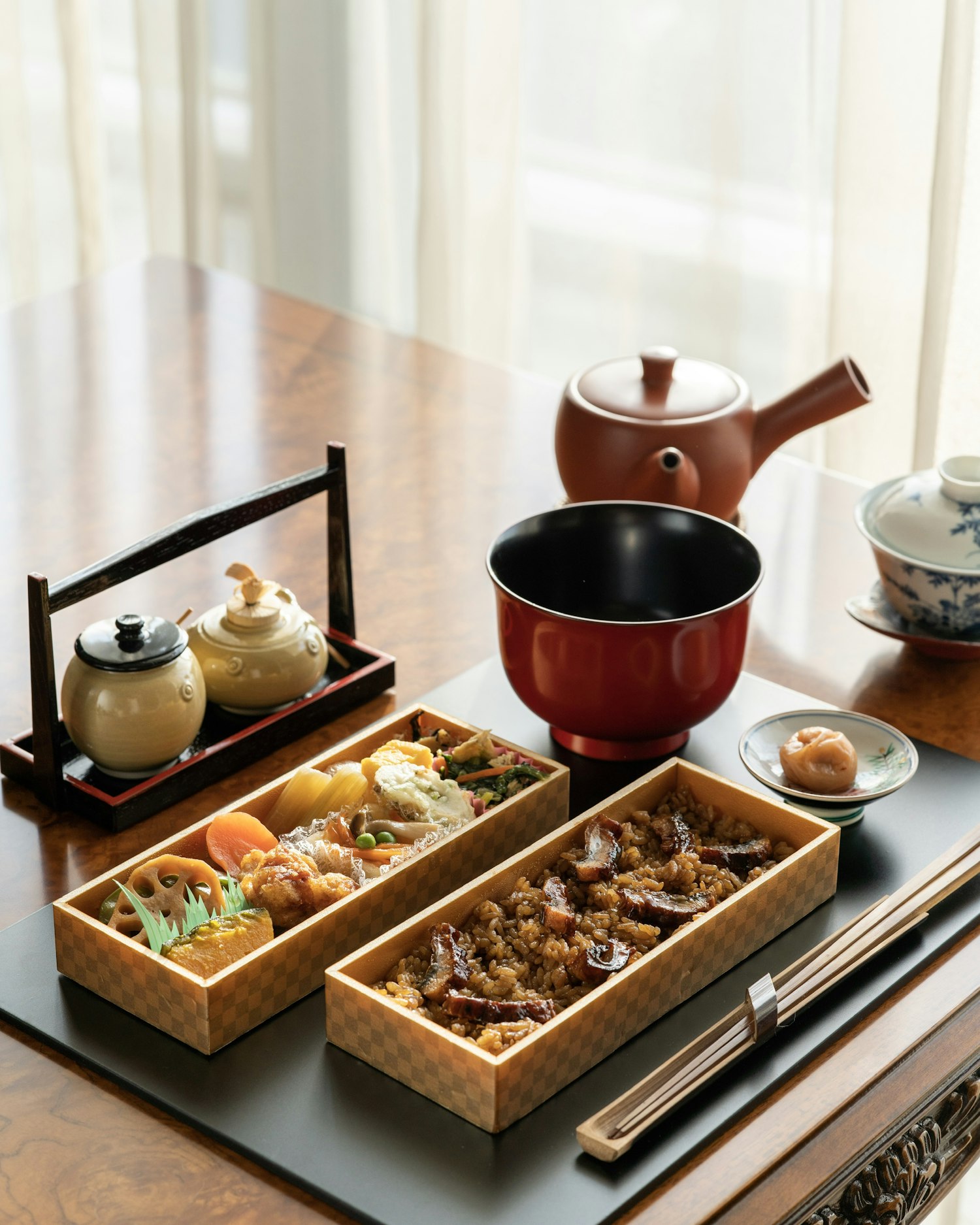 A quiet table setting with bowls and chopsticks